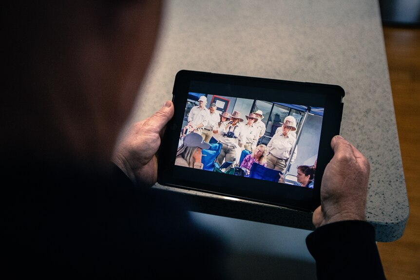 an ipad showing a video of people in sheriff uniforms