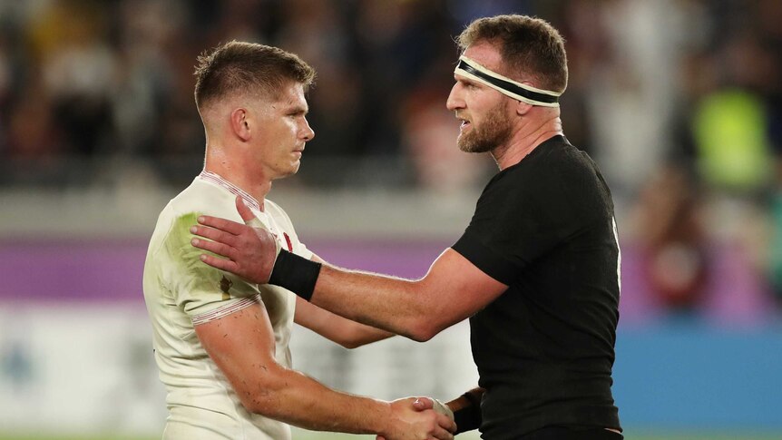 An England rugby union player shakes hands with a New Zealand opponent after the full-time siren.