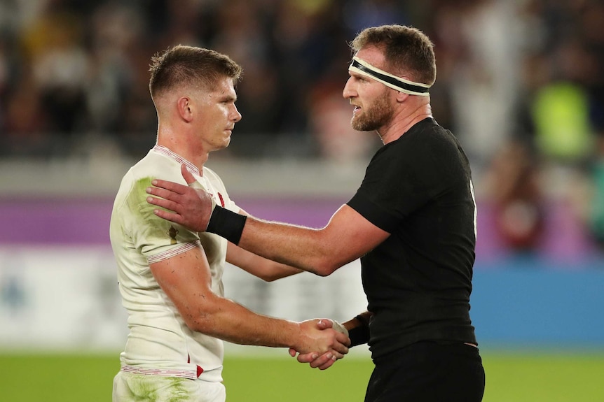 An England rugby union player shakes hands with a New Zealand opponent after the full-time siren.