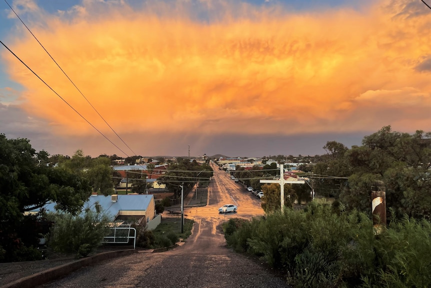 A spectacular sunset over an outback city.