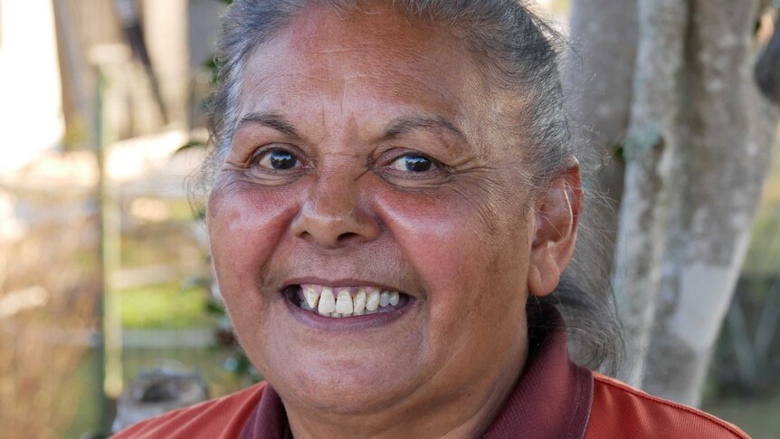 Close portrait of a Dhanggati woman smiling