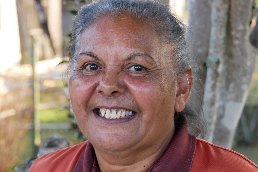 Close portrait of a Dhanggati woman smiling