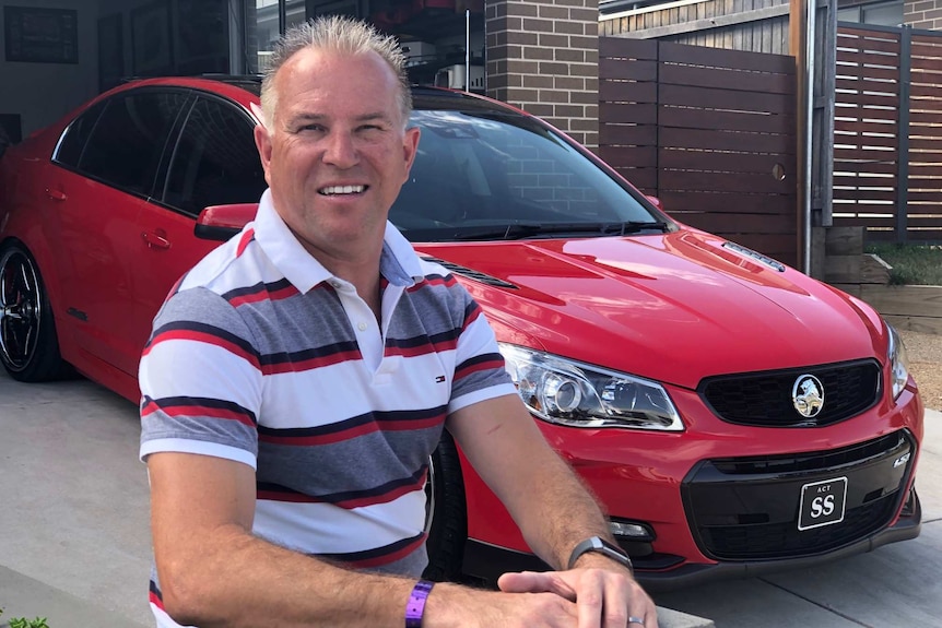 Steve Gregorsky in front of his Holden.