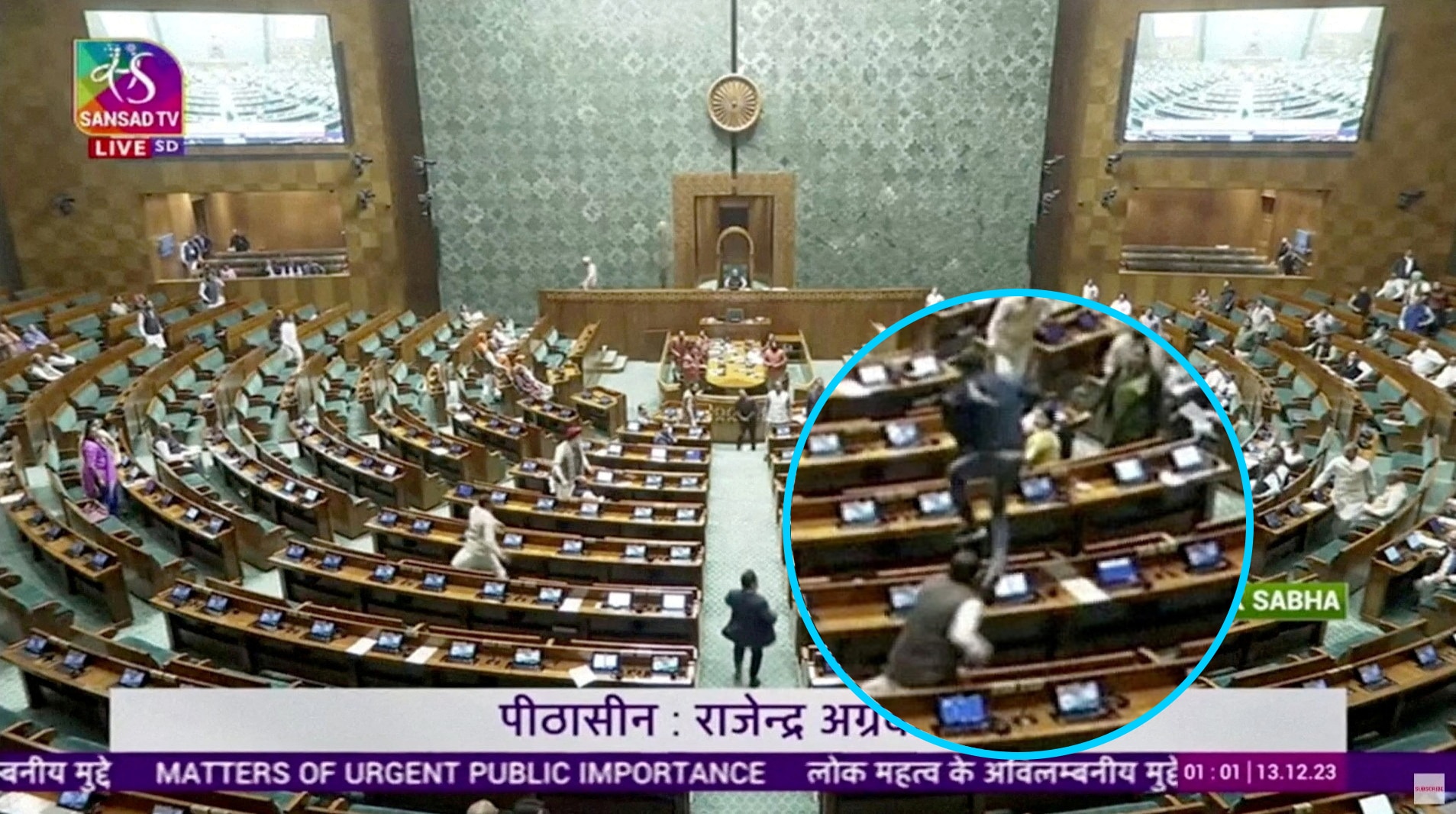 A man jumps into the the lower house of the Indian Parliament.