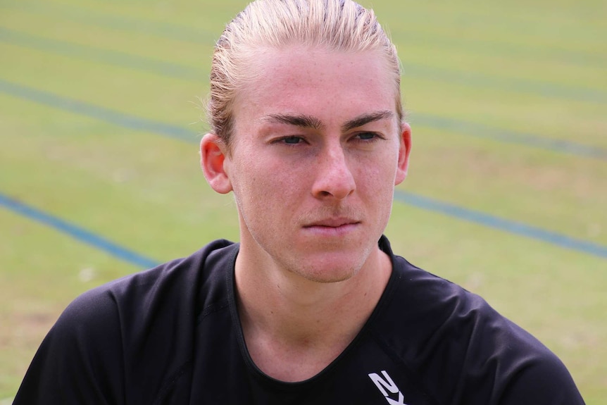 A close up of Declan Tingay on a sporting oval.