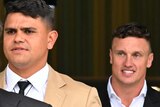 Latrell Mitchell and Jack Wighton leave court.