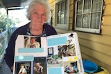 Beverley Rubenach holding a scrapbook of happy memories of her son Tim.