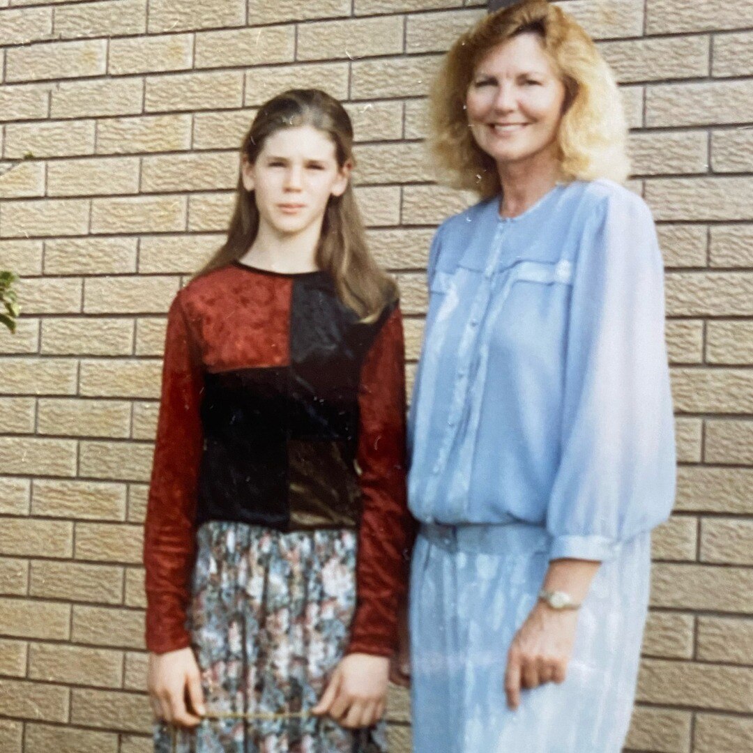 A film photograph of a mother in a blue shirt next to her younger daughter.