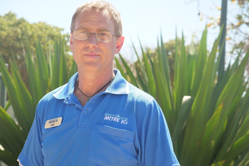 Jody Cole from Mitre10 stands in front of a garden