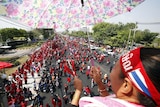 Supporters of former premier Thaksin Shinawatra protest outside a Thai army base.
