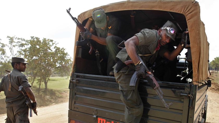 Sri Lankan soldiers on guard near Dharmapuran