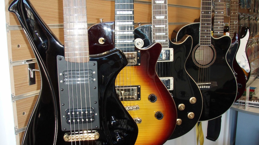 Guitars at Tom Graham's Fyshwick warehouse. Taken December 2013.