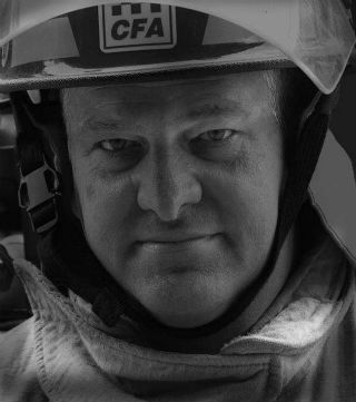 A man wearing a firefighter's hat