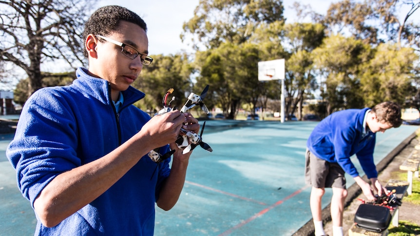 Nathaniel and Cale at school getting ready to fly their drones.