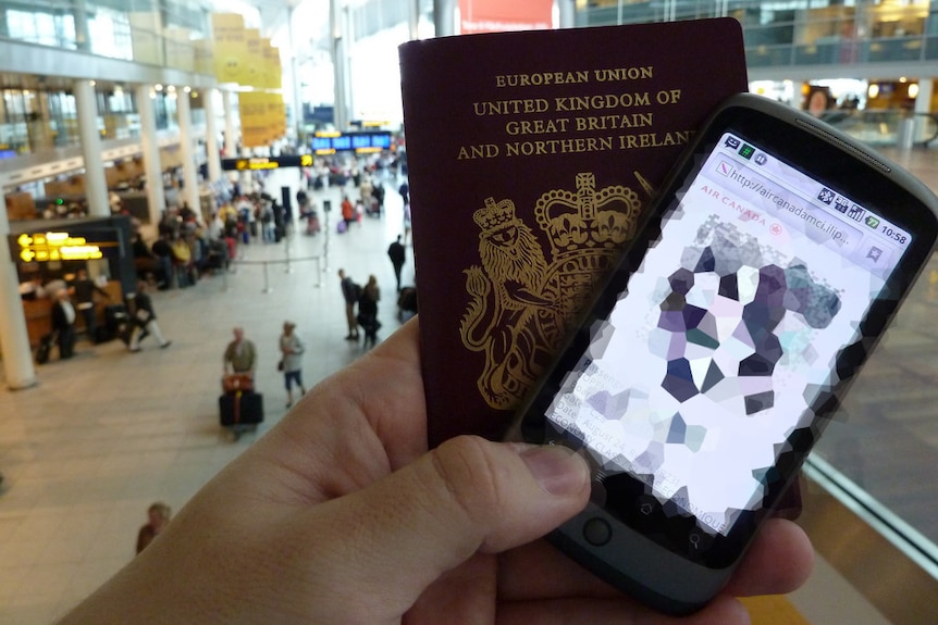 A man holds his passport and his digital boarding pass on his phone.