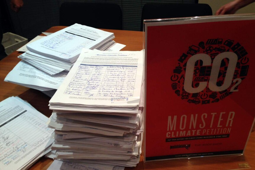 Stacks of signatures on the Monster Climate Petition