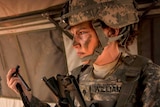 A female US soldier in combat.