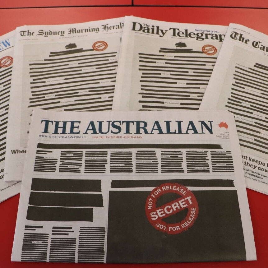 Front pages of major newspapers across Australia include black ink censorship and secret stamp as part of press freedom stamp.