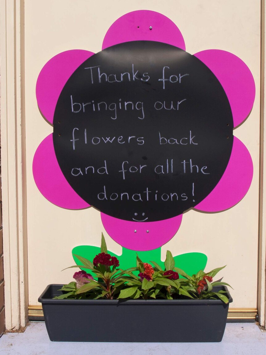 Thanks for bringing our flowers back sign of appreciation.