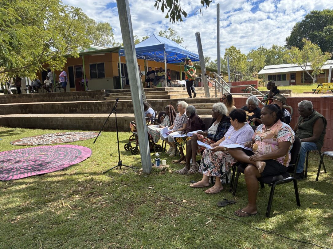 group of people sitting around in an ampitheatre
