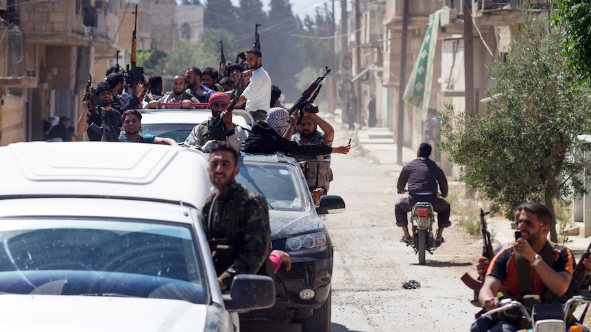 Members of the Free Syrian Army return to Qusayr near the Lebanese border in Homs province.