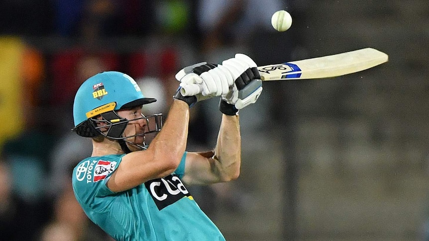 Brisbane Heat batsman Sam Heazlett plays a shot up at the cricket ball during a Big Bash League game.