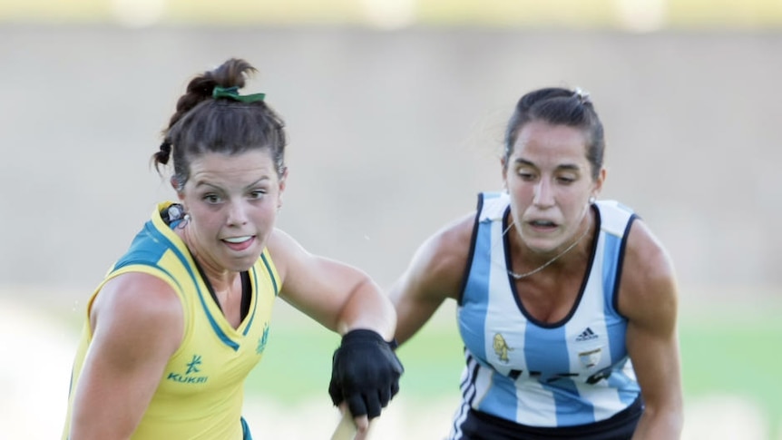 Tough stuff ... Kellie White battles with an Argentinian defender.