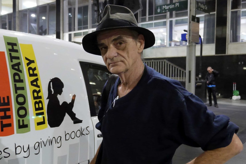 Hank Maslak standing near a van