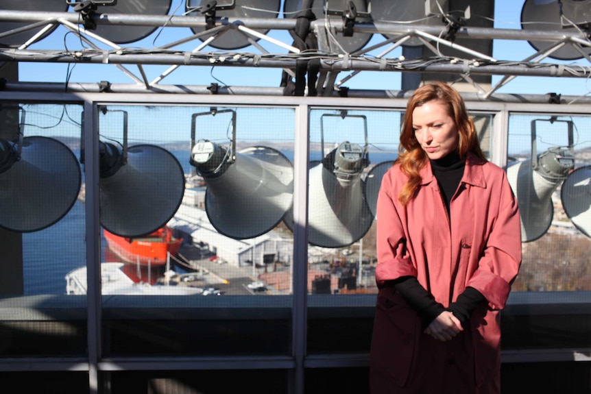 Hannah Fox Siren Song project collaborator on building top with speakers.