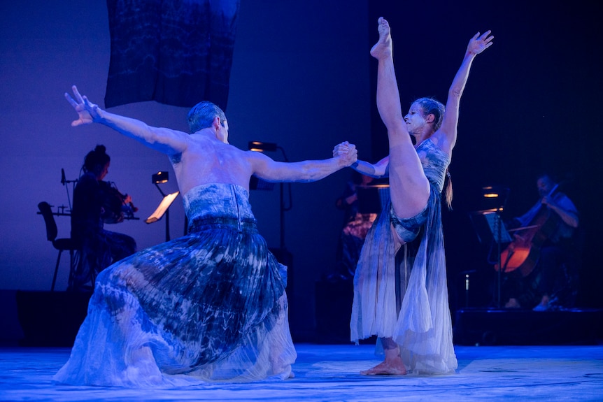 Two dancers perform the spirit's journey.