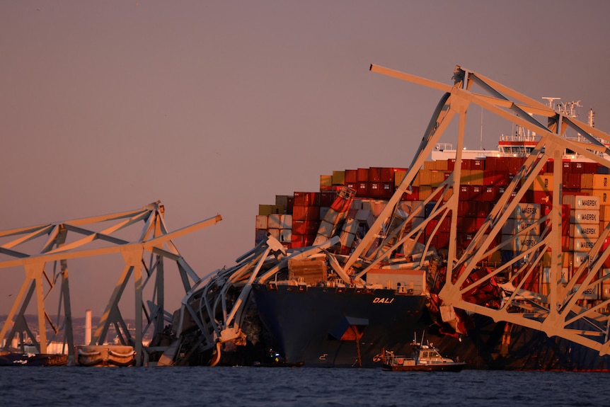 a smashed bridge close up over a cargo ship