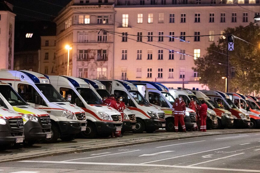 A fleet of ambulances was put on standby next to a cordoned off zone.