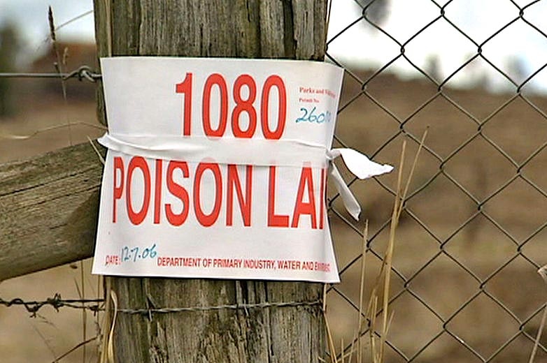 A sign on a fence indicates 1080 poison in use