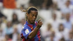 Ronaldinho dribbles the ball.
