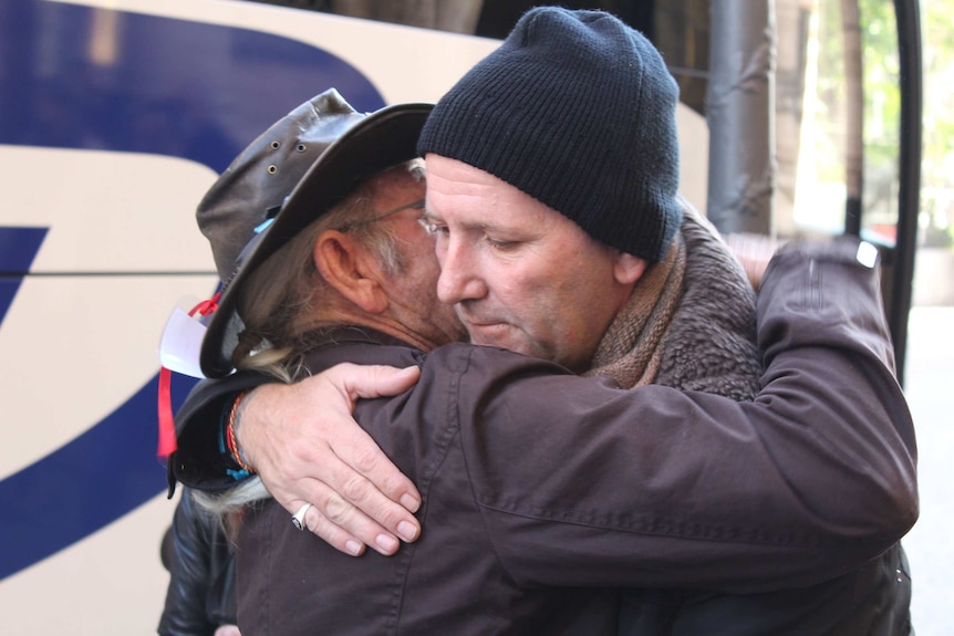Clergy abuse survivors Gordon Hill and Paul Levey hug each other in Rome following a visit to the Vatican in 2016.