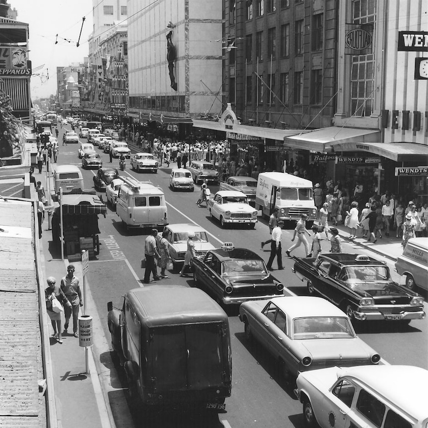 Cars drive along Rundle Street in Adelaide.