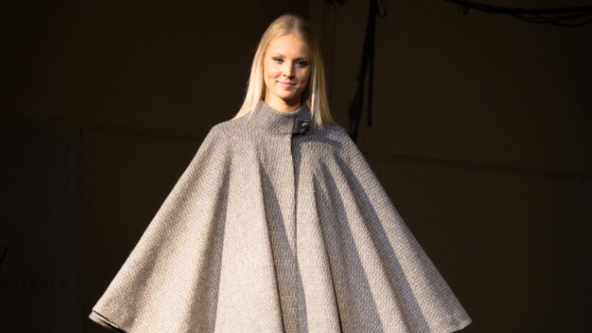 Model flaunts woollen garment designed by young Australian fashion students.