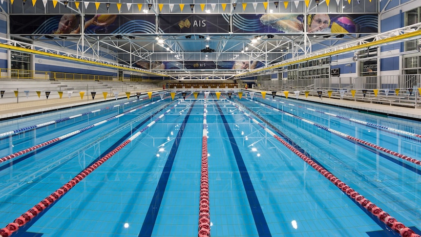 A large Olympic-sized indoor swimming pool.