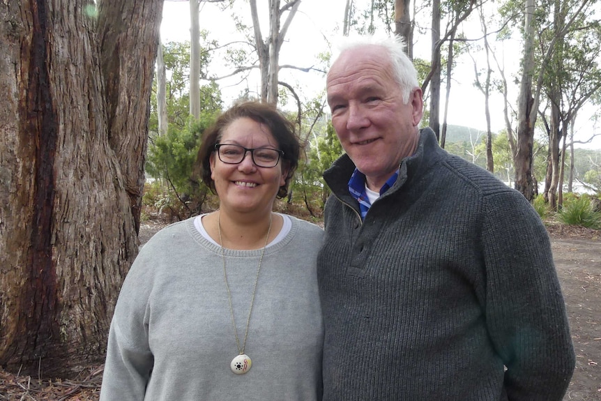 Fiona Hughes and Mark Redmond in bushland.