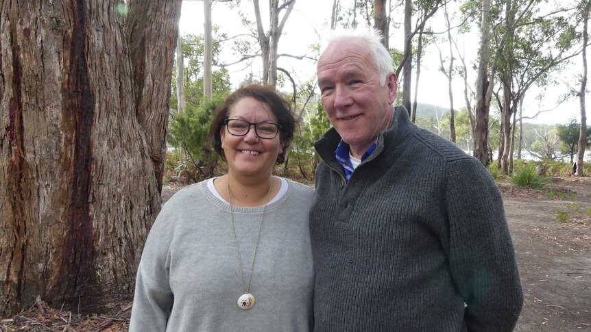 Fiona Hughes and Mark Redmond in bushland.