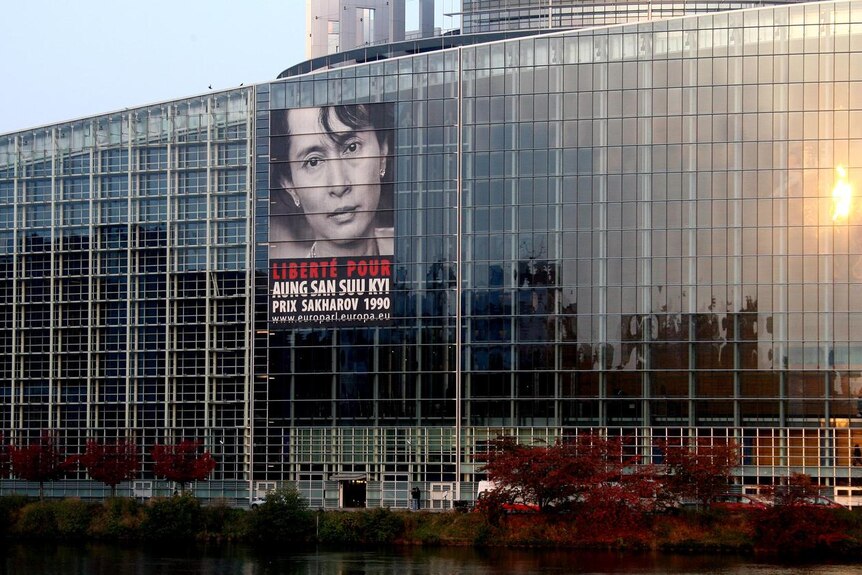 A giant poster of Aung San Suu Kyi sits on the European Parliament in October 2007.