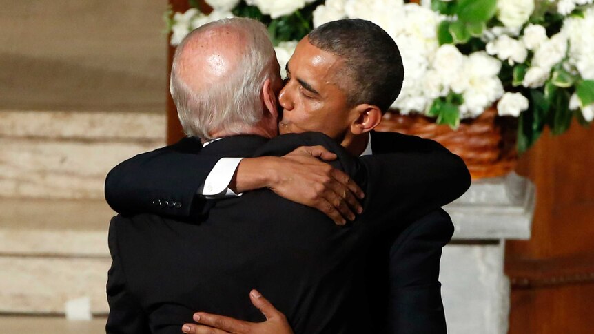 US President Barack Obama hugs Vice President Joe Biden