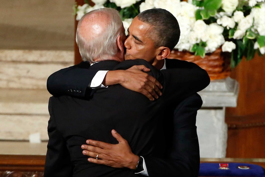 US President Barack Obama hugs Vice President Joe Biden.