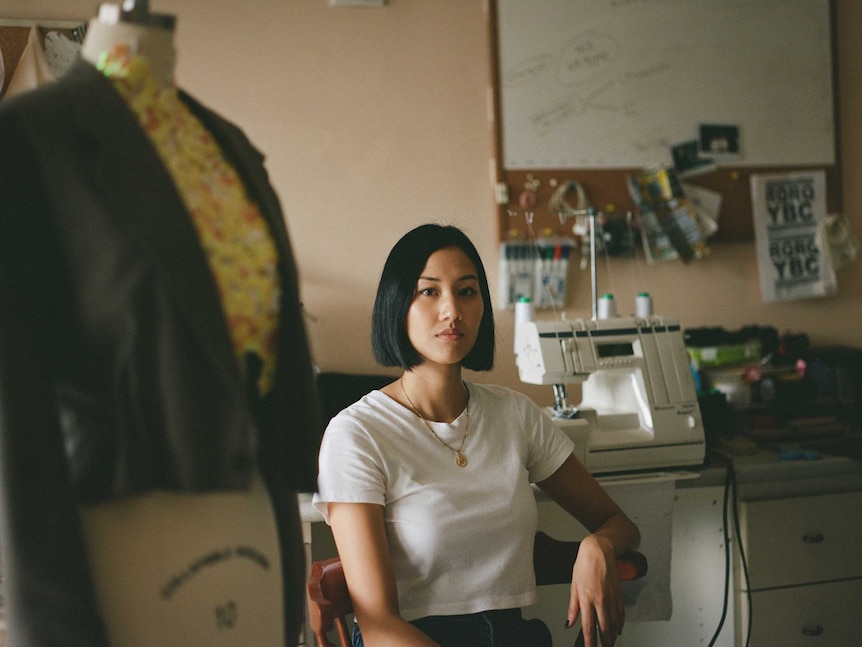 Designer Nicole Oliveria sits in her studio.