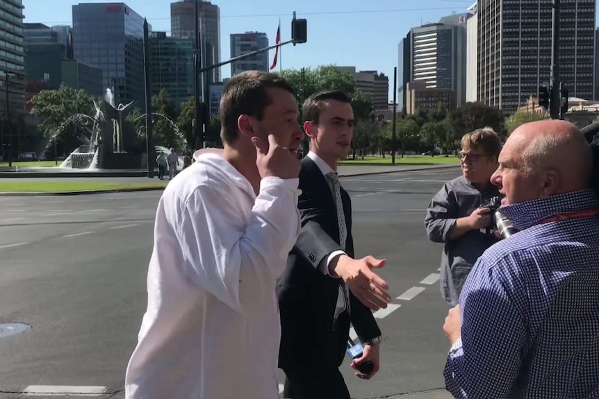 A man confronts the media outside an Adelaide court.