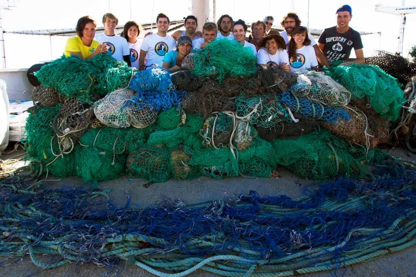 Members of the Ocean Cleanup crew with a monster ghost net