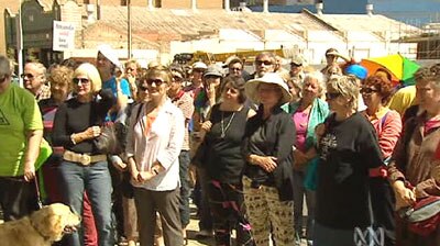 Protesters gather outside Amanda Vanstone's office.