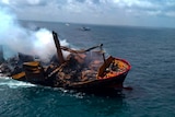 Smoke rises from a fire onboard the MV X-Press Pearl vessel as it sinks while being towed into deep sea off the Colombo Harbour.
