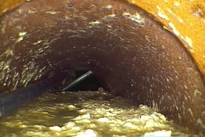 Old clay pipe sewer line block with disposable wipes, Tasmania.