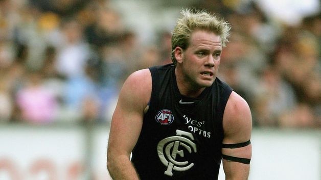 Nick Stevens runs the ball for Carlton